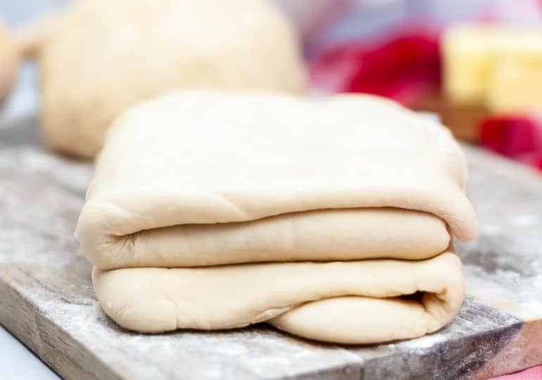 puff pastry on wooden cutting board