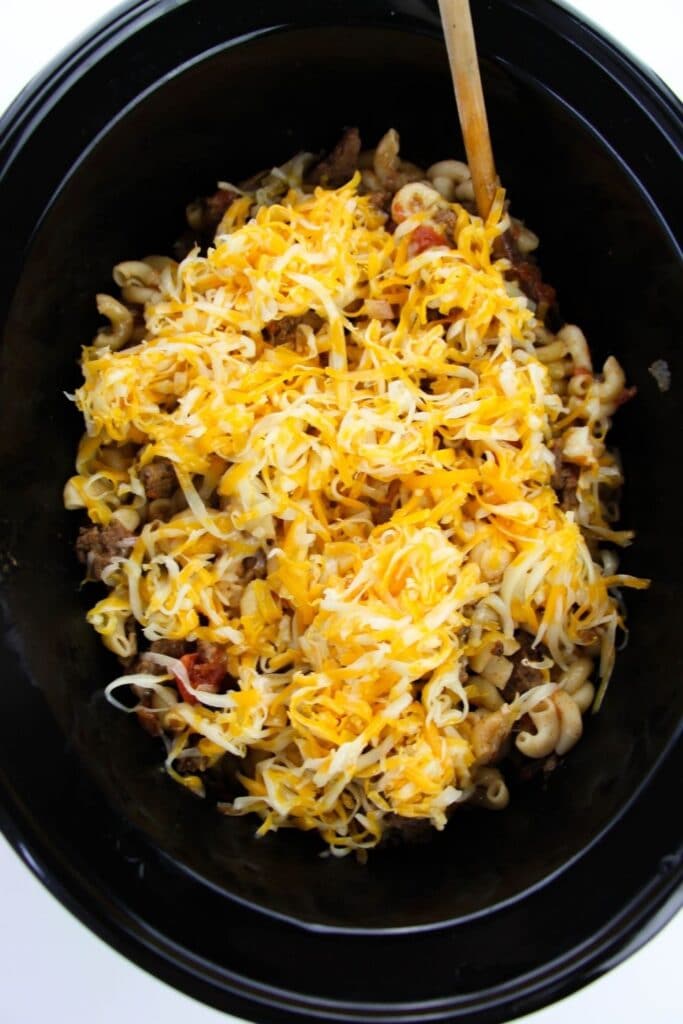 overhead shot of cheesy pasta in crock pot 