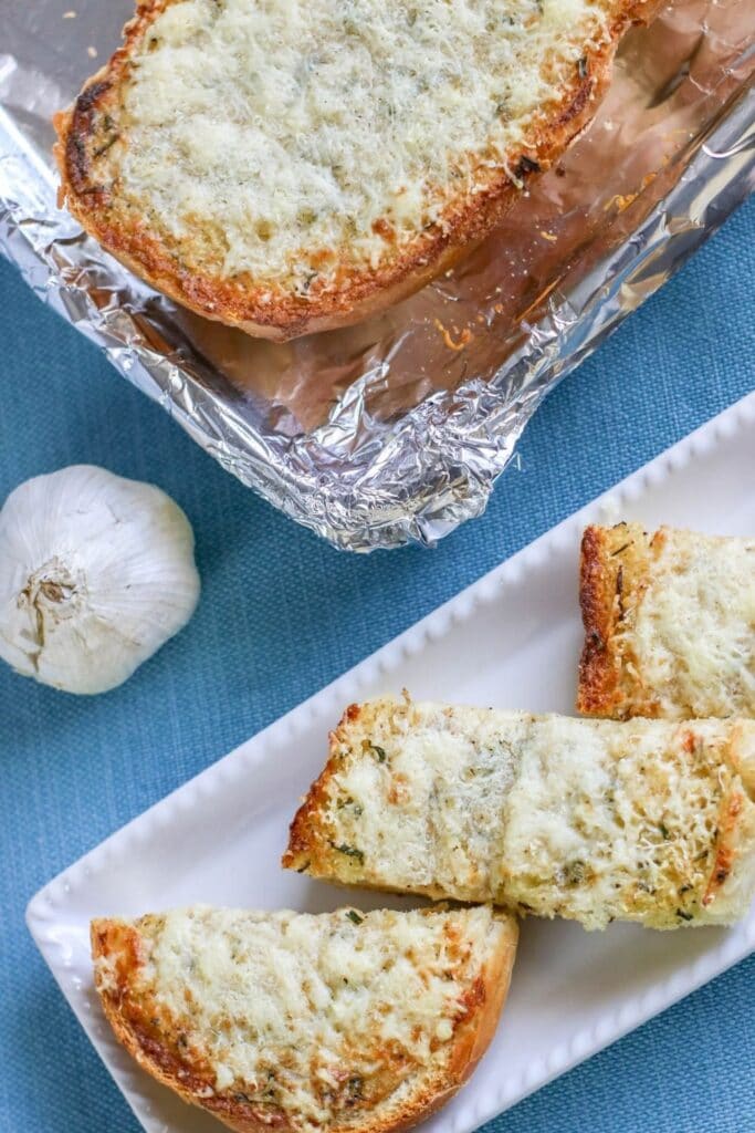 bread on a tray and full slice on baking sheet 