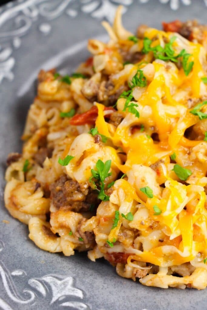 cheesy beef pasta on a grey plate