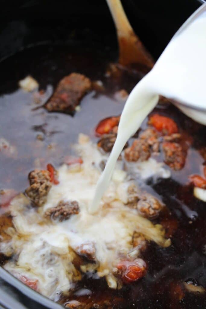 pouring milk into crock pot