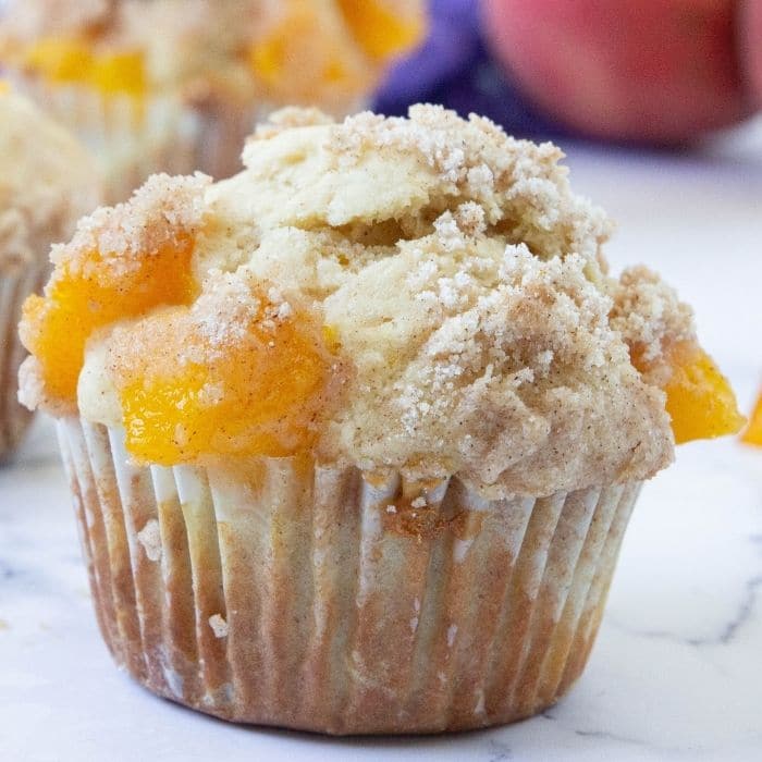 peach cobbler muffin on counter