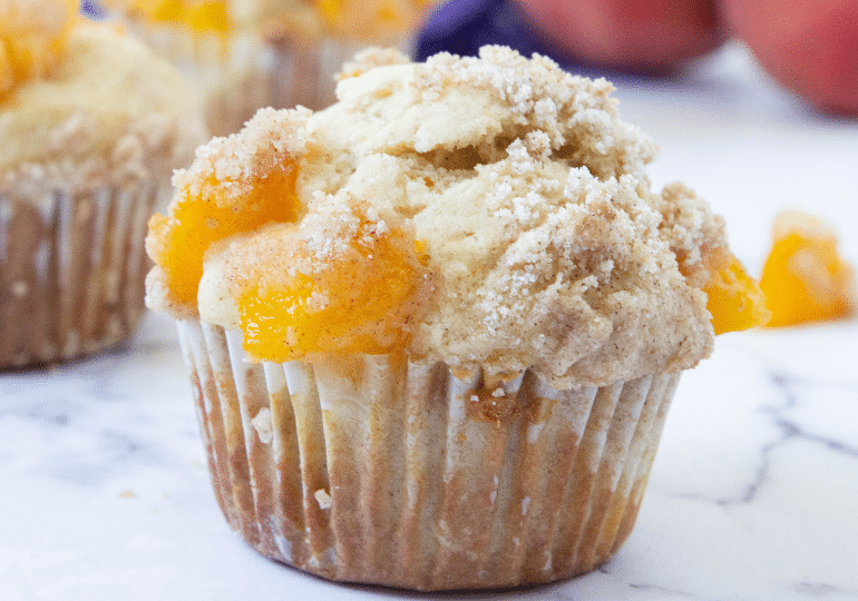 close up of peach muffin on table