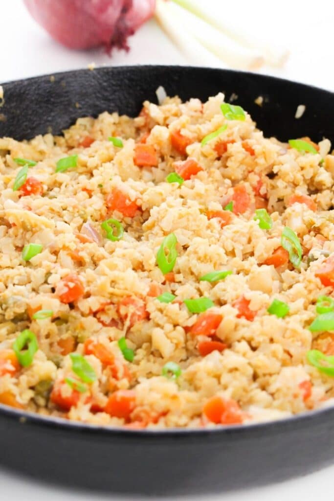 cauliflower fried rice in cast iron skillet