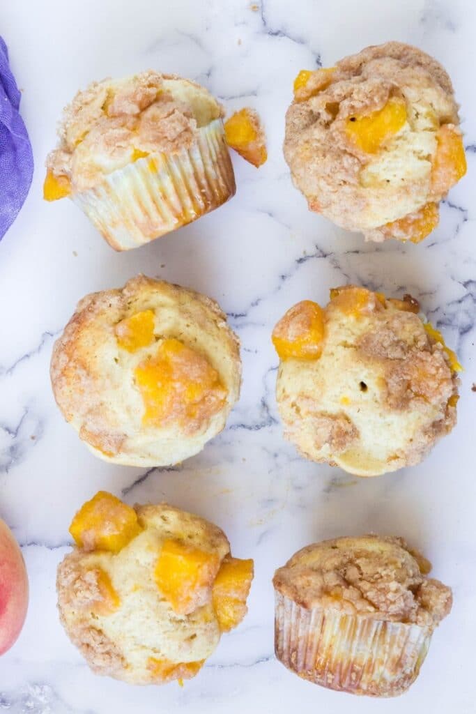 muffins on a marble counter in rows