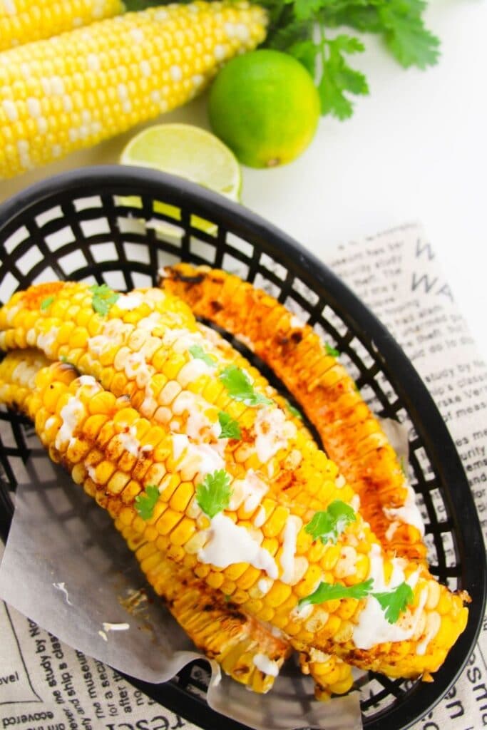 overhead shot of corn ribs in a black basket