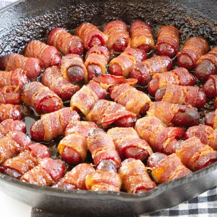 smokies baked with bacon in a cast iron skillet 