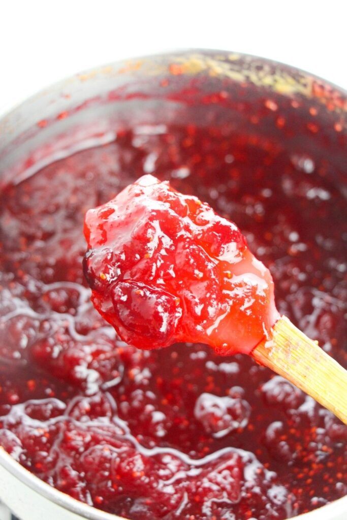 wooden spoon with cranberry sauce on it 