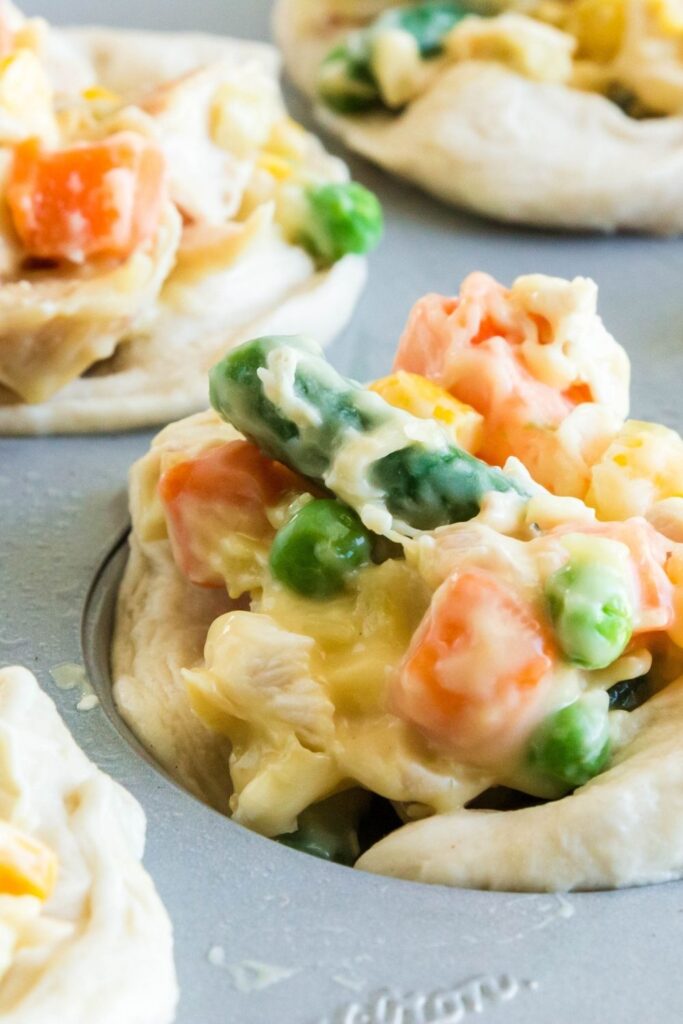 creamy pot pie close up of raw pot pie in muffin tin 