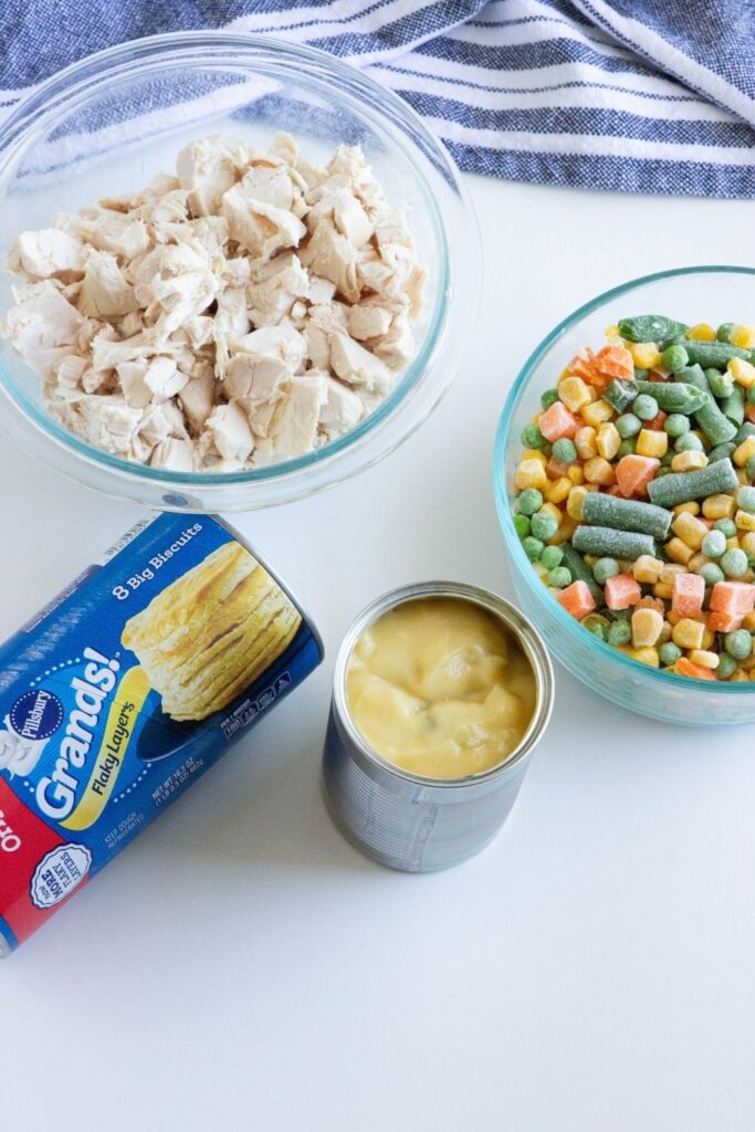 chicken pot pie ingredients in glas bowls on counter 