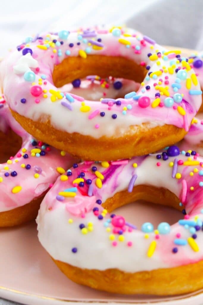 donuts stacked on top of each other on a plate 