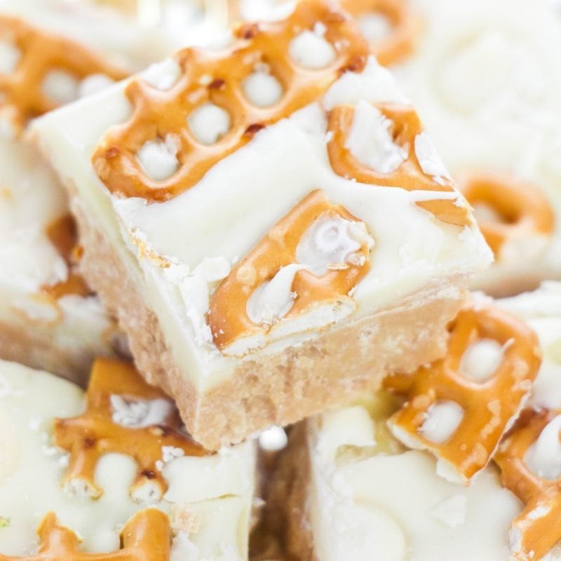 White chocolate fudge stacked on top of each other on plate 