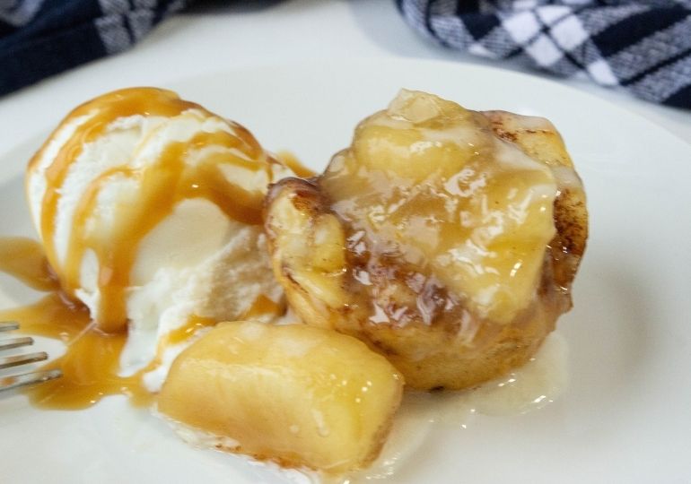 cinnamon roll cup on plate with ice cream