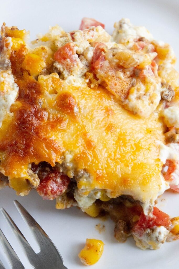 ground beef cheesy casserole on plate on counter 