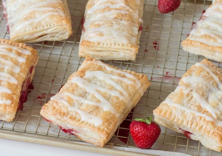 cooking tray with strudels on it