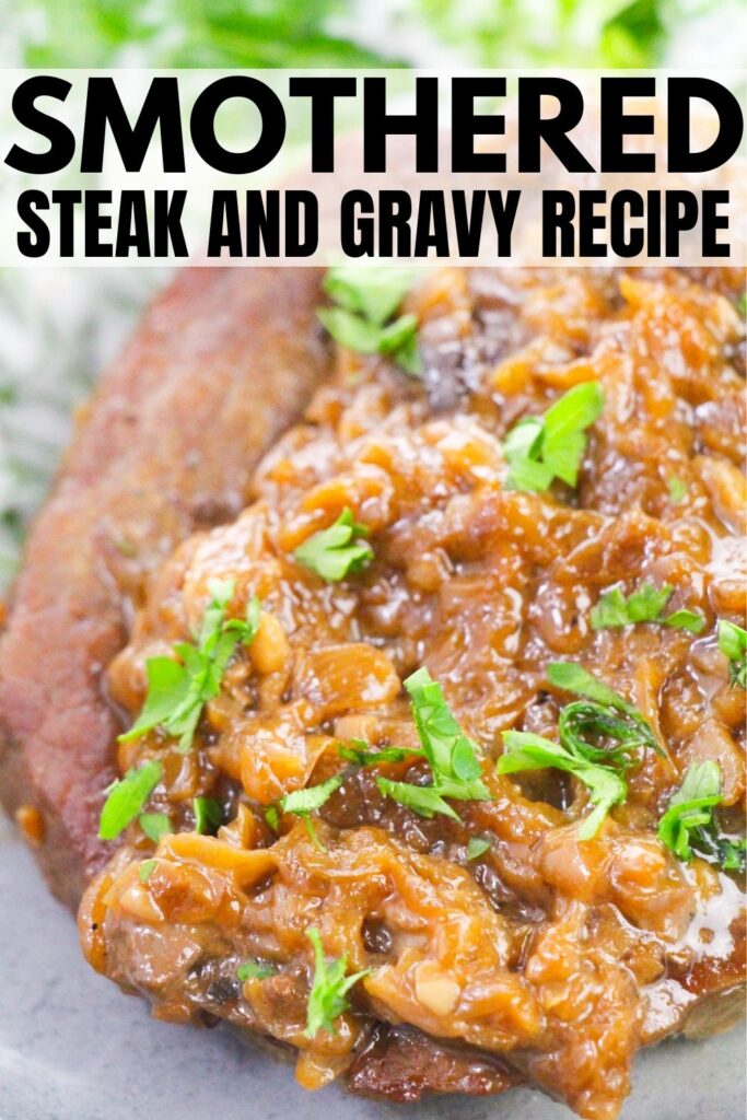 smothered steak on a plate with garnish 