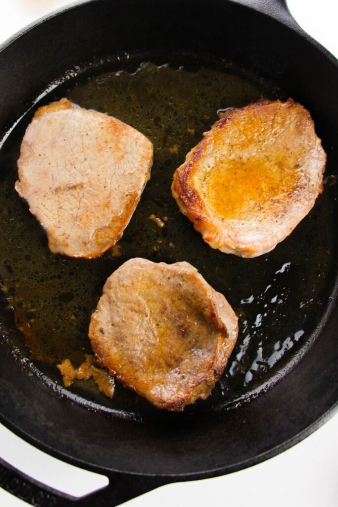 steak seared in a cast iron skillet