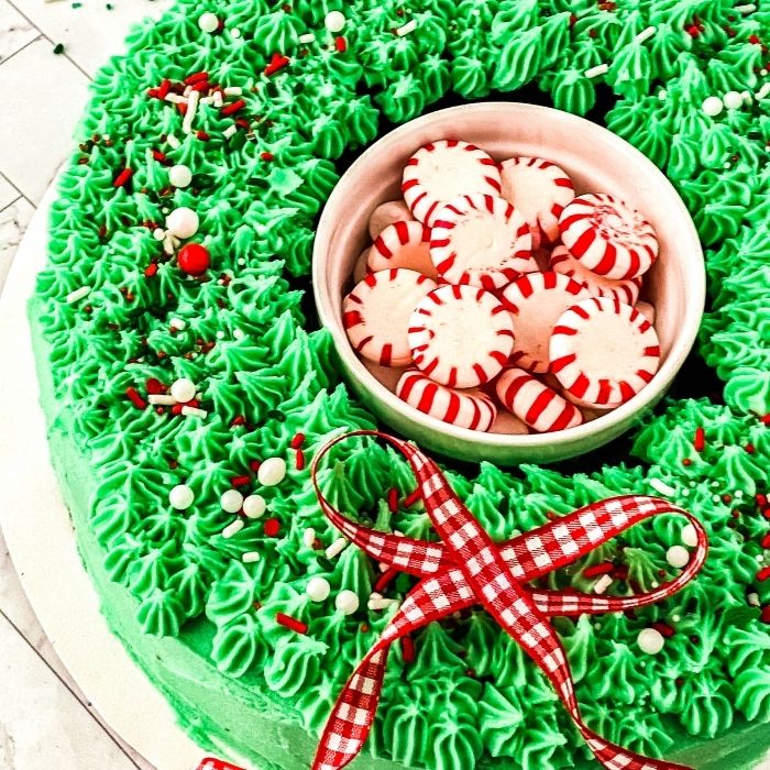 overhead shot of wreath cake on plate with peppermints in center 