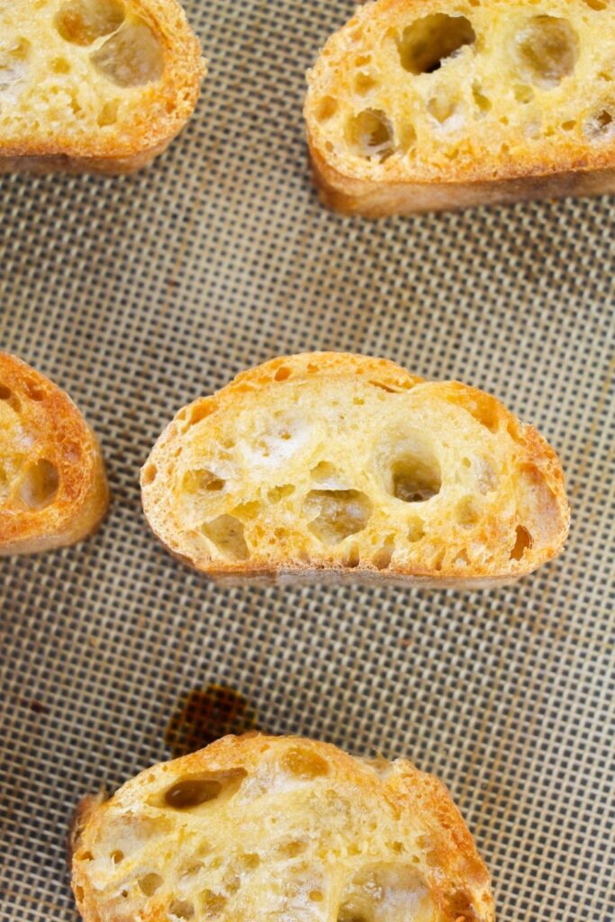 crispy baguette on baking sheet 