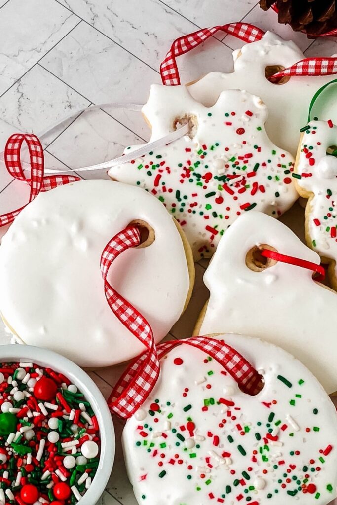 table with a handful of Christmas sugar cookies