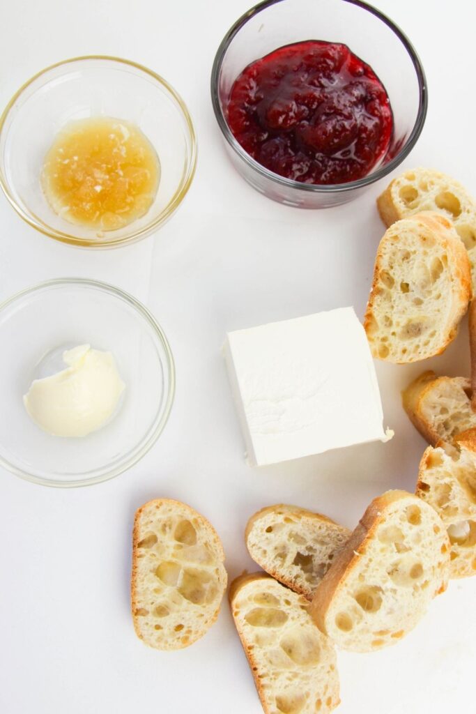 ingredients for a crostini appetizer on a white counter 