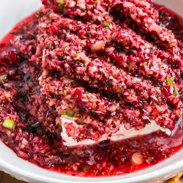 cranberry jalapeno dip in a white bowl 