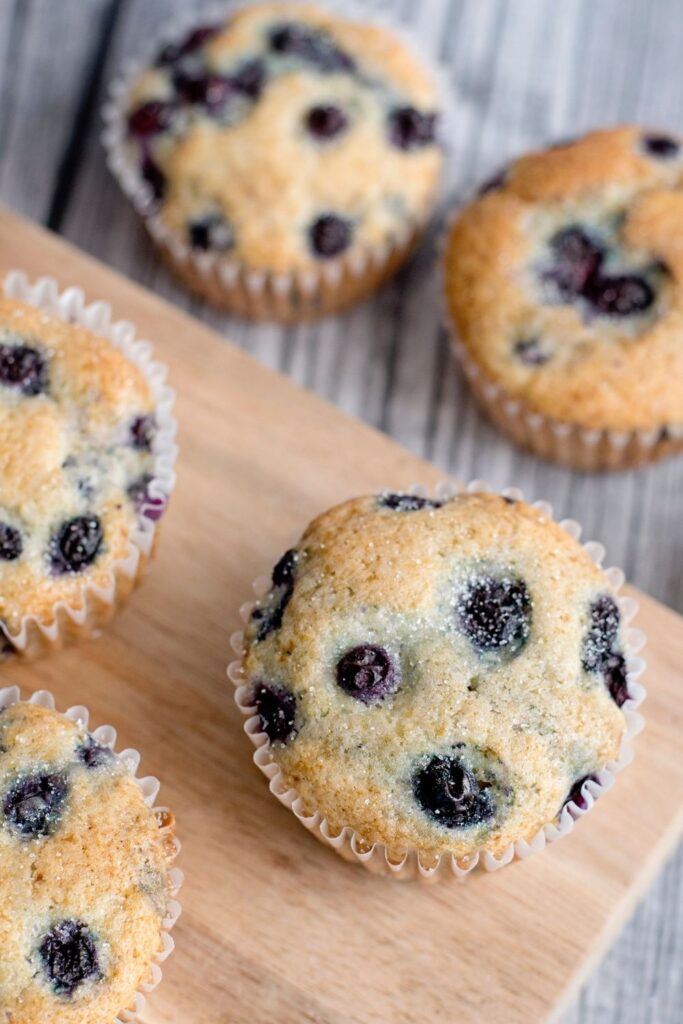 muffins on table and wooden cutting board 