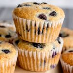 stacked muffins on wooden counter