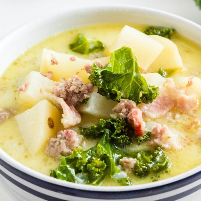 potato kale soup in a bowl on table