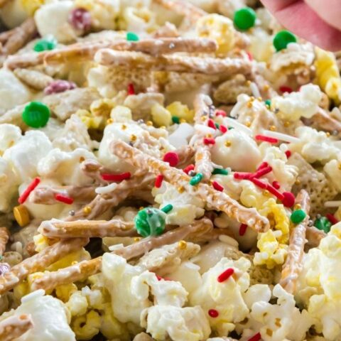pretzel snack mix with chocolate sprinkled all over and sprinkles