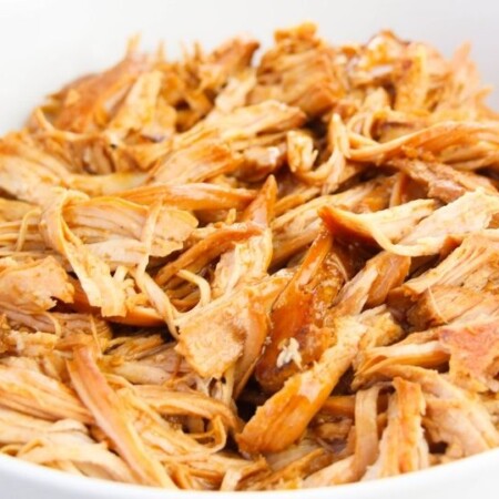 pulled chicken in a bowl on counter
