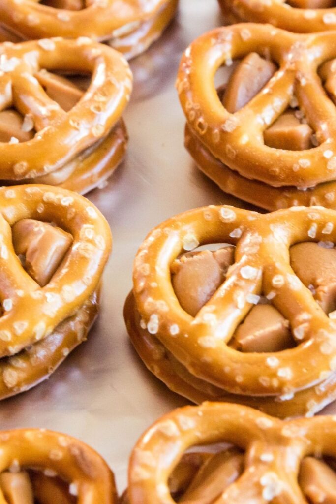 caramel stuffed pretzels on baking tray 