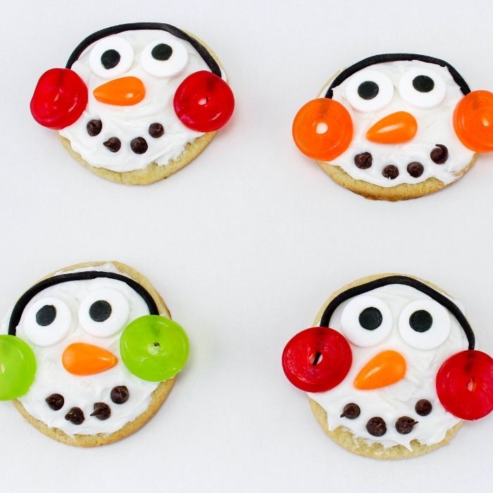 sugar cookies that look like snowman on white counter 