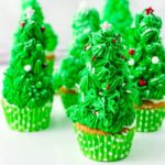 christmas tree cupcakes on white counter