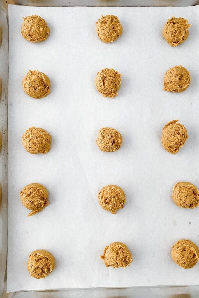 gingersnap cookie dough on baking sheet rolled in balls 