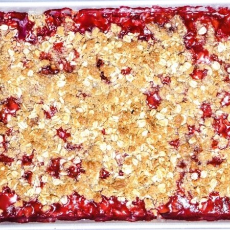 overhead shot of cherry crisp in a baking pan