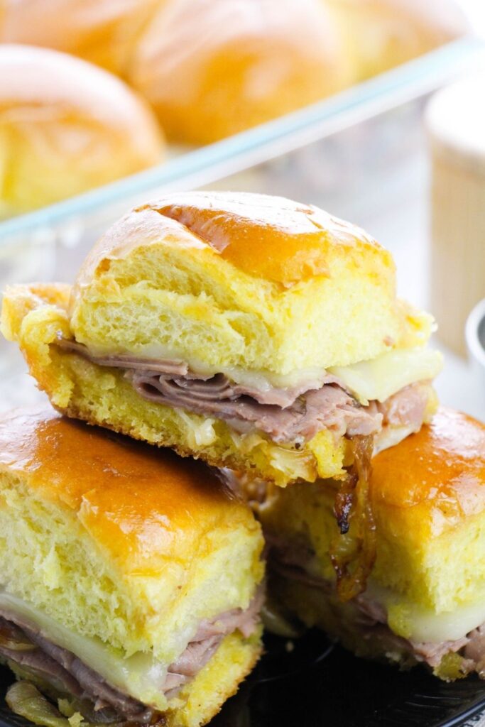 roast beef hawaiian roll sliders stacked on a plate 