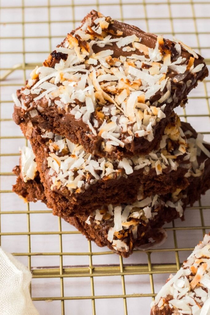 brownies stacked on top of each other on a cooling rack