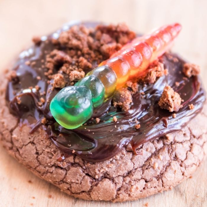 zoomed in picture of a dirt cake brownie cookie on wooden cutting board