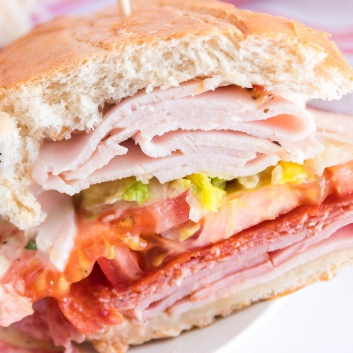 close up of a sliced Grinder Sandwiches  on plate 