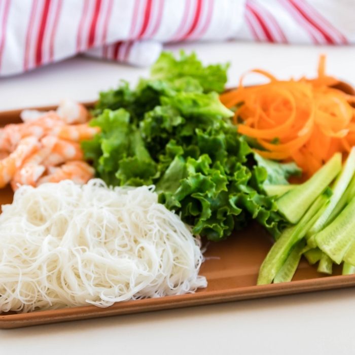 ingredients for spring rolls on metal container 