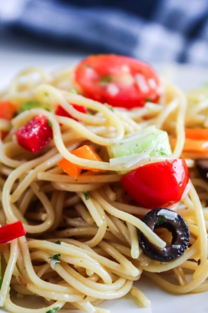 spaghetti salad plated up on a white plate