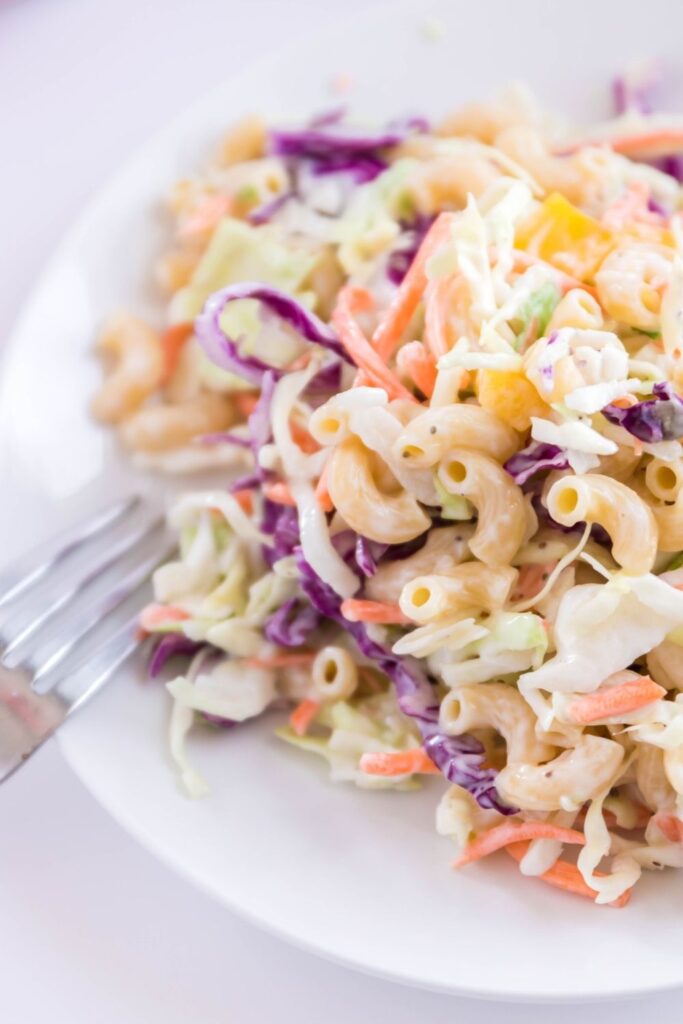 salad coleslaw on white plate with fork