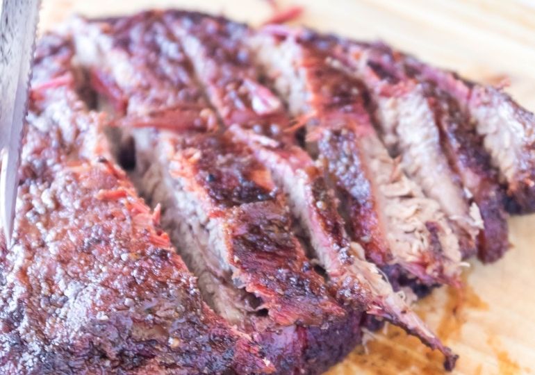 Smoked Brisket sliced on cutting board 