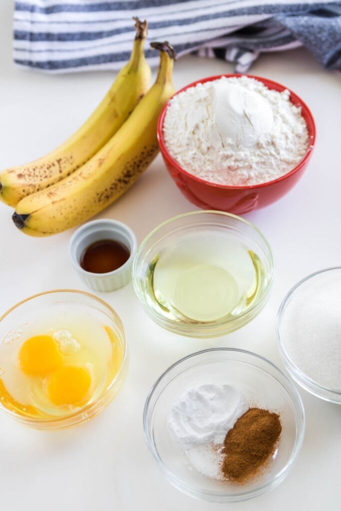 banana muffins ingredients on white counter 