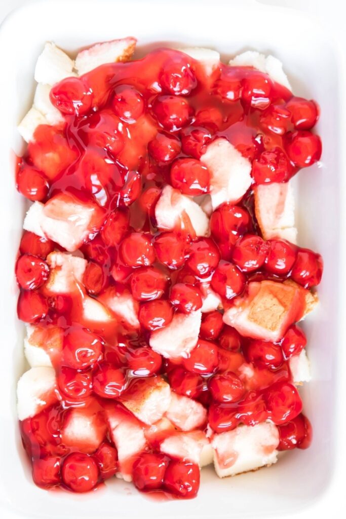 overhead shot of cherries and angel food in pan 