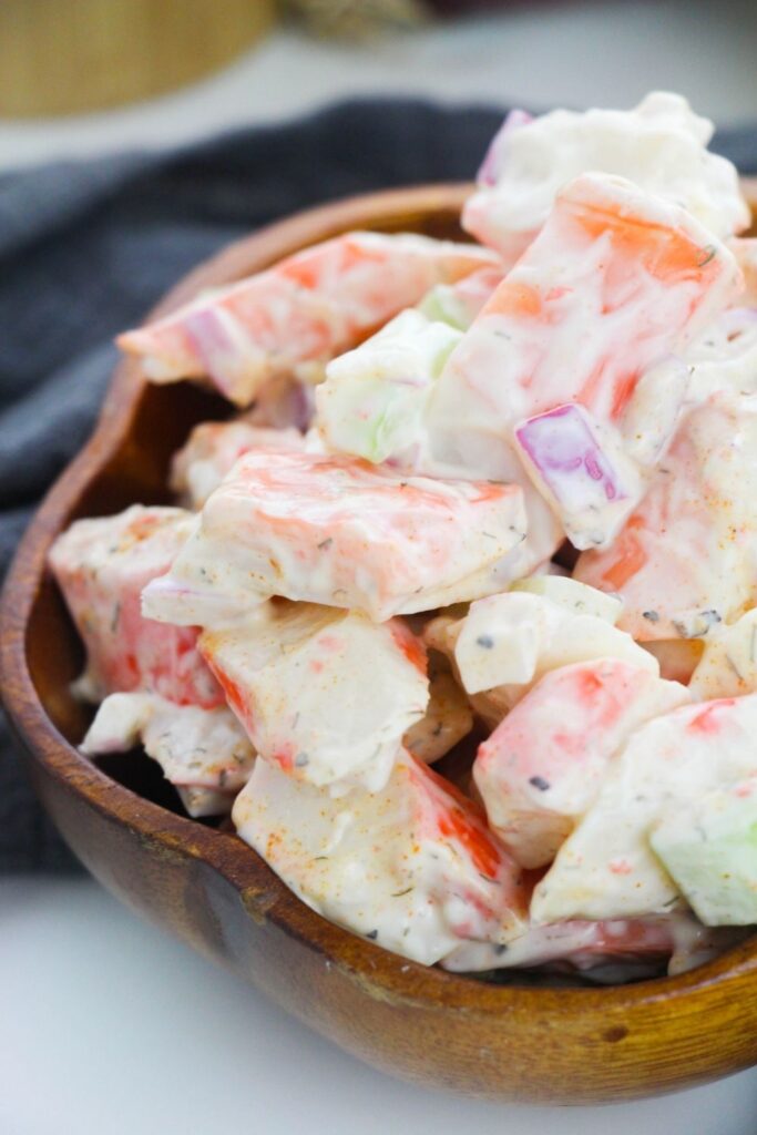 crab meat salad in a bowl on table 