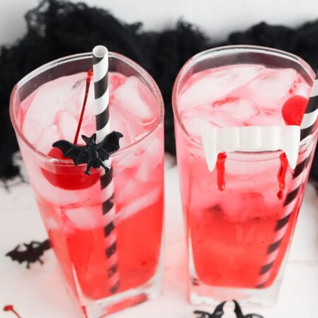 halloween drinks on table with plastic decor