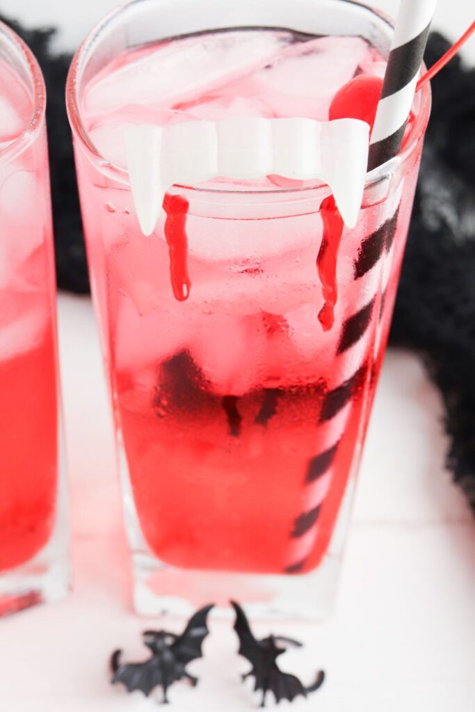 halloween cherry drink on table with straw in it 