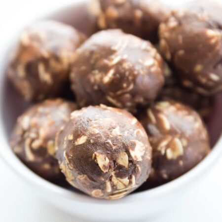 Chocolate Peanut Butter Protein Balls in a white bowl on table